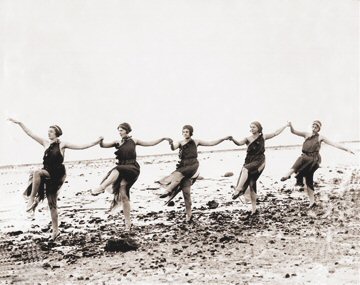 women dancing on the beach