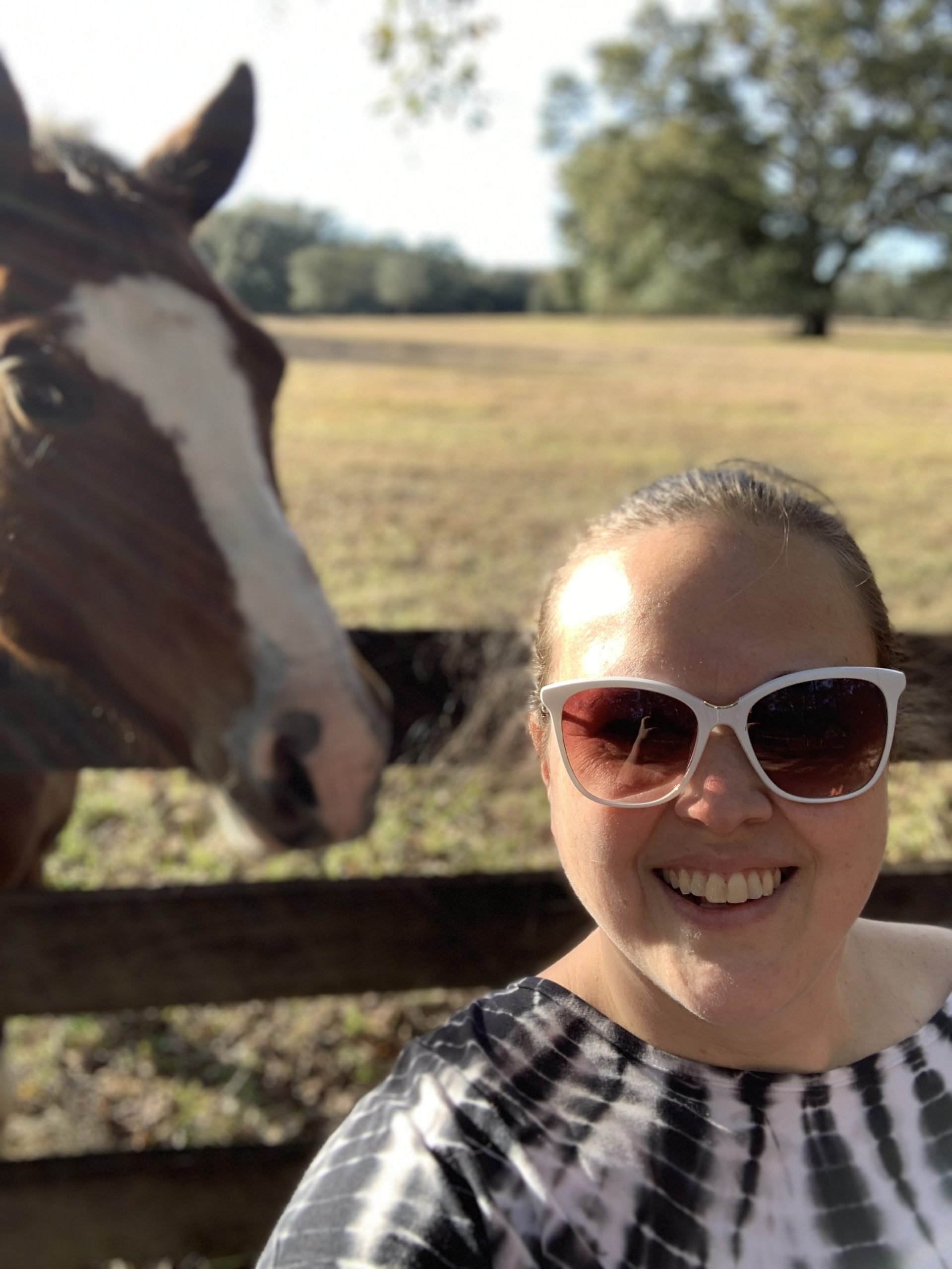Amber Powers standing next to a horse